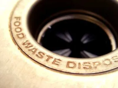 Kitchen garbage disposal unit under a sink