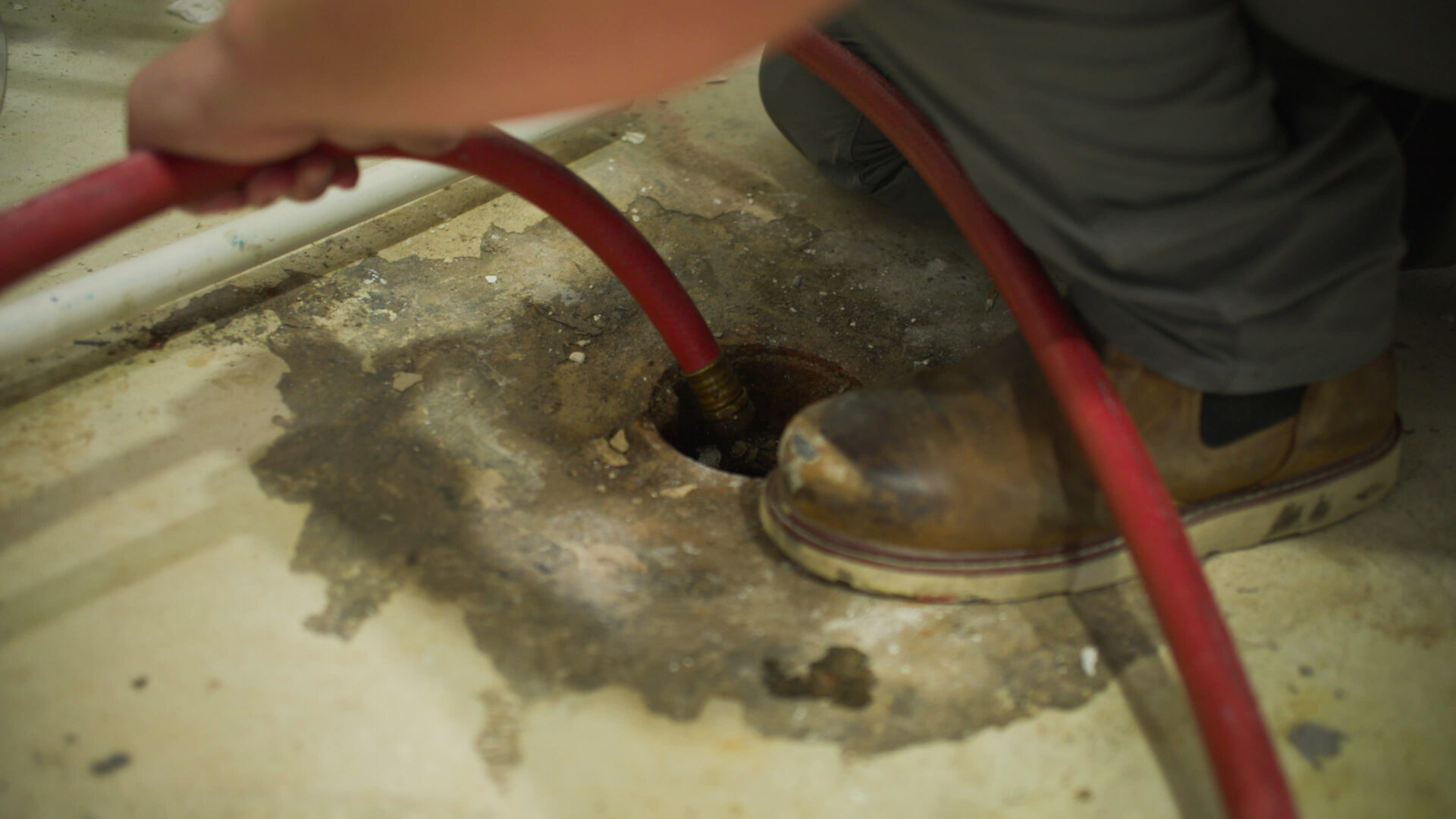 Donahue Plumber cleaning a drain at a customers home in Salt Lake City Utah