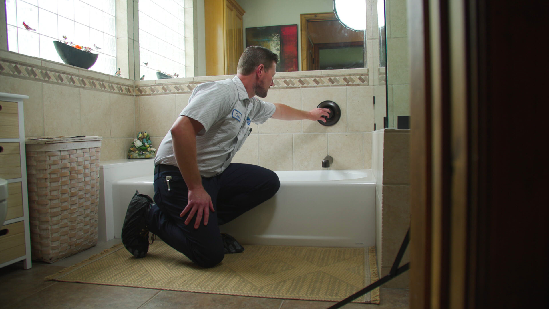 Donahue Plumbing installing a new bathroom shower faucet