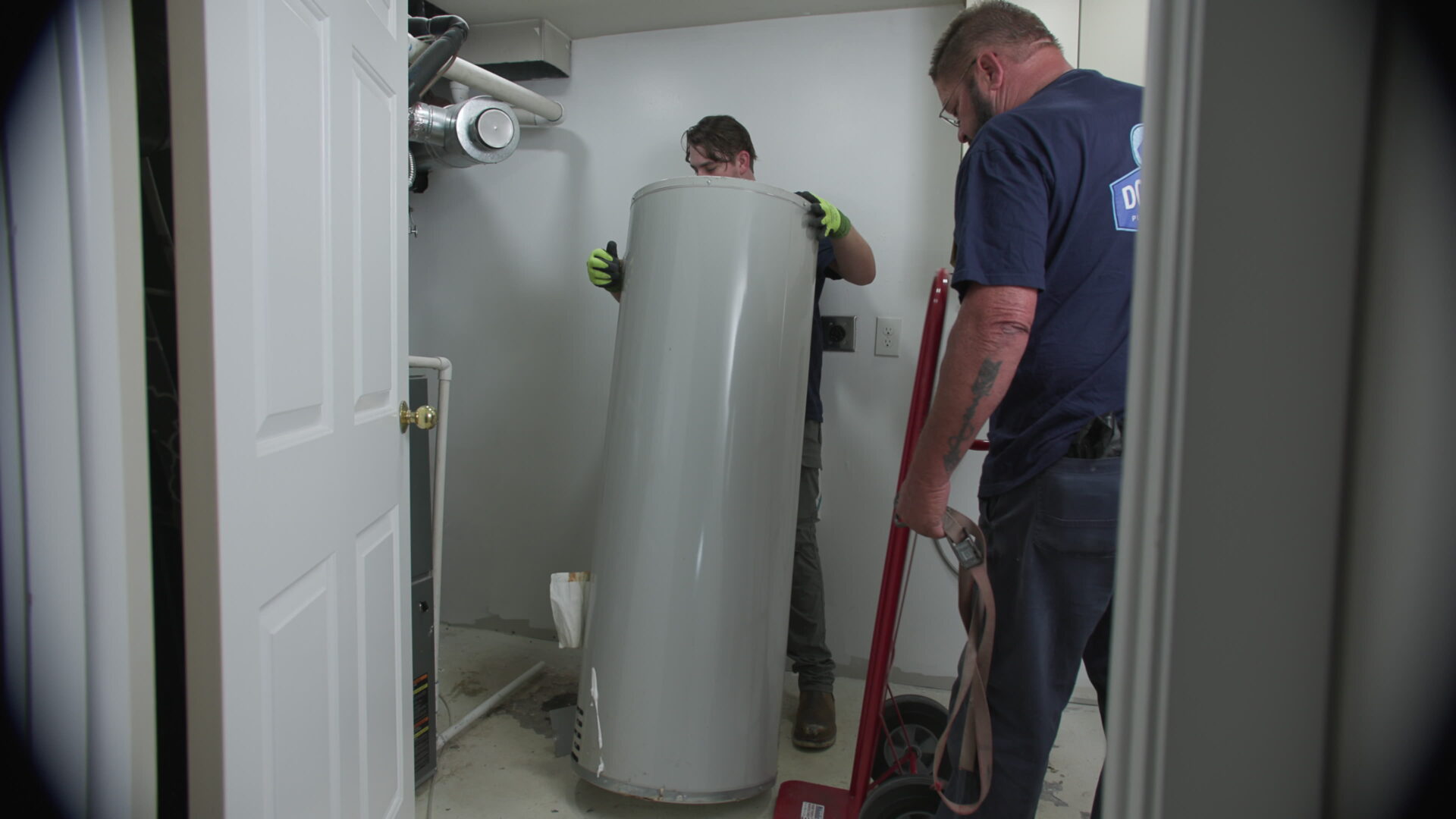 Donahue Plumbing Technicians Removing a Residential Tank Water Heater